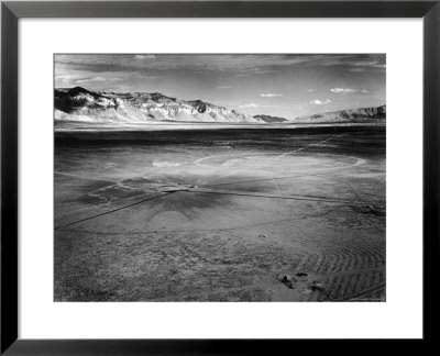 Aerial View Of The First Atomic Bomb's Dark Scar Below Sierra Oscura Mountain In Desert by Fritz Goro Pricing Limited Edition Print image