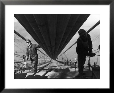 Two Workmen Adding Last Two Strands To Enormous Cables That Supports 6 Lane Golden Gate Bridge by Peter Stackpole Pricing Limited Edition Print image