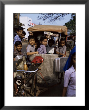 Schoolchildren In Cycle Rickshaw, Aleppey, Kerala State, India by Jenny Pate Pricing Limited Edition Print image