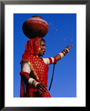 Performer Dancing With Water Pot At Holi Festivities, Jaipur, India by Paul Beinssen Pricing Limited Edition Print image