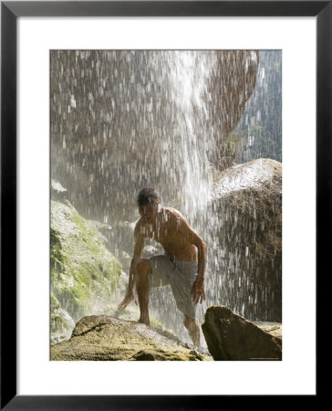 Young Man Enjoys Refreshing Tar Creek Waterfalls, California by Rich Reid Pricing Limited Edition Print image