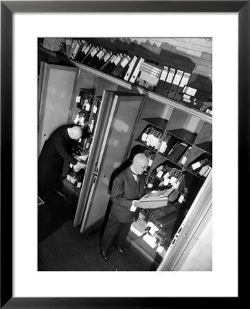Bank Workers Filing Textile Shares In Steel Vaults At Deutches Bank by Margaret Bourke-White Pricing Limited Edition Print image