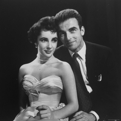 Elizabeth Taylor In Strapless Gown And Montgomery Clift In Suit by Peter Stackpole Pricing Limited Edition Print image