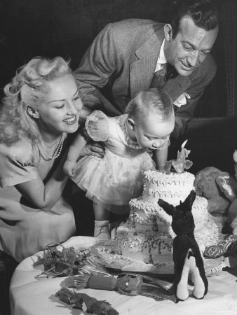 Bandleader Harry James With His Actress Wife Betty Grable Looking At Daughter Victoria Elizabeth by Peter Stackpole Pricing Limited Edition Print image