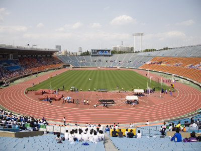 Spectators Watching Track And Field At National Stadium, Jingu Gaien Park, Shinjuku-Ku by Noboru Komine Pricing Limited Edition Print image