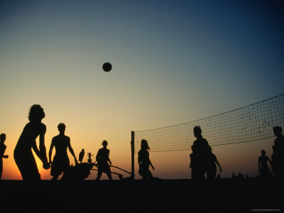 Game Of Beach Volleyball At Sunset On Arambol Beach by Paul Bigland Pricing Limited Edition Print image