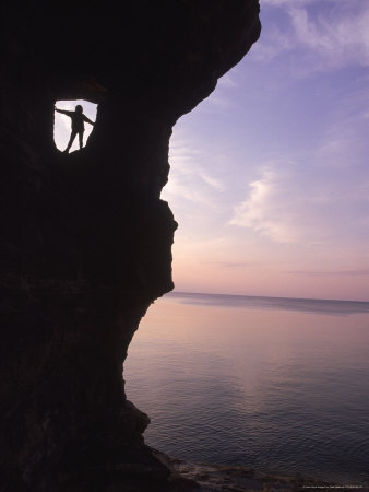 Climber Near Lakeside Rock Formation, Mi by Nels Akerlund Pricing Limited Edition Print image