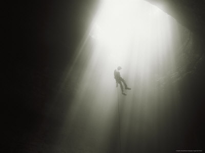 Caver Rappels The Entrance Drop Of A 150 Foot Deep Cave Pit by Stephen Alvarez Pricing Limited Edition Print image