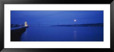 Memorial Lit Up At Night, Monument To The Discoveries, April 25Th Bridge, Lisbon, Portugal by Panoramic Images Pricing Limited Edition Print image