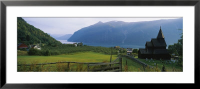 Church In A Village, Urnes Stave Church, Lustrafjorden, Luster, Sogn Og Fjordane, Norway by Panoramic Images Pricing Limited Edition Print image