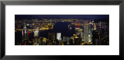 Buildings Illuminated At Night, Hong Kong by Panoramic Images Pricing Limited Edition Print image
