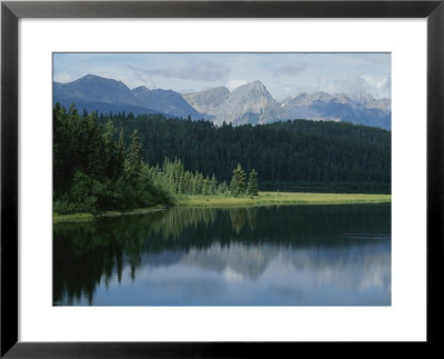 A Beautiful Mountain Scene Reflected In A Peaceful Mountain Lake by Raymond Gehman Pricing Limited Edition Print image