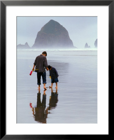 Father And Son Playing, Cannon Beach, Oregon, Usa by Janis Miglavs Pricing Limited Edition Print image