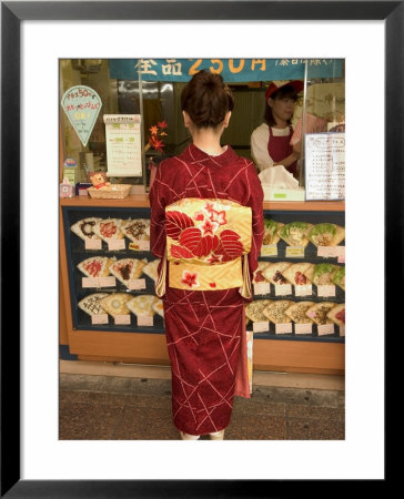 Girl In Kimono, Yukata Buying Crepe, Kyoto City, Honshu, Japan by Christian Kober Pricing Limited Edition Print image