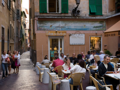 Visitors Stroll The Streets In Old Nice, Cote D'azure, France by Robert Eighmie Pricing Limited Edition Print image