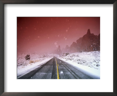 Road With Falling Snow, Arches National Park, Utah by Thomas Winz Pricing Limited Edition Print image