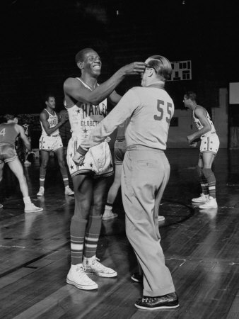 Harlem Globetrotter Reece Goose Tatum Joking With The Referee During A Basketball Game by J. R. Eyerman Pricing Limited Edition Print image