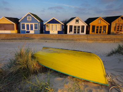 Beach Huts And Boat On Mudeford Spit, Mudeford, Dorset, England, United Kingdom, Europe by Adam Burton Pricing Limited Edition Print image