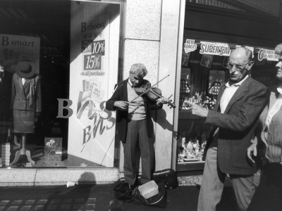 Bling Violinist Busking - Oxford Street, London by Shirley Baker Pricing Limited Edition Print image