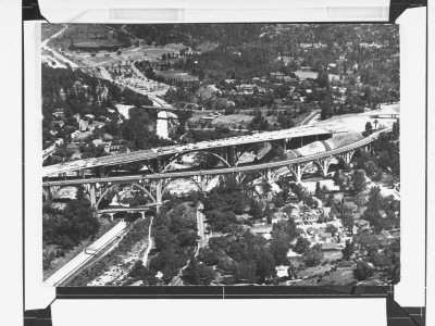 Aerial View Of Construction Of New Six-Lane Bridge Spanning The Arroyo Seco On Hollywood Freeway by J. R. Eyerman Pricing Limited Edition Print image