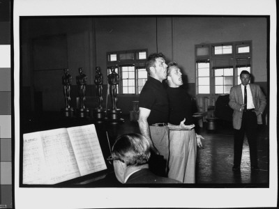 Burt Lancaster And Kirk Douglas Singing As Other Plays Piano At Rehearsal For 30Th Academy Awards by Leonard Mccombe Pricing Limited Edition Print image
