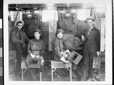 Women Electric Welders In Work Stations Alongside Male Co-Workers At Hog Island Shipyard, Wwi by Paul Thompson Pricing Limited Edition Print image
