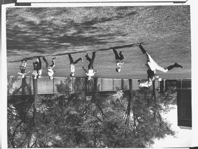 Drum Major Practicing His High-Kicking Prance As He Leads A Line Of Seven Admiring Children by Alfred Eisenstaedt Pricing Limited Edition Print image