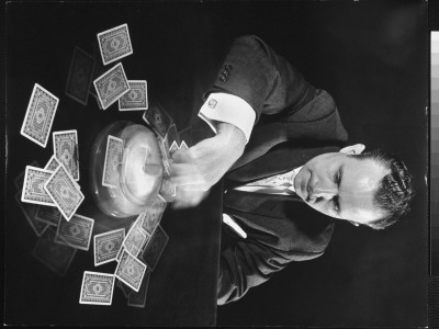 Frank Wirth Demonstrating His Card-Dealing Apparatus At International Gadget And Invention Show by Ralph Morse Pricing Limited Edition Print image
