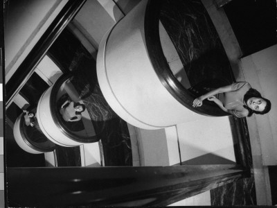 Triple Exposure Of Actress Anna Magnani On The Stairway Landings Of Her Rome Apartment by Gjon Mili Pricing Limited Edition Print image