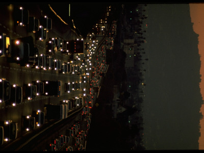 Bumper-To-Bumper Traffic At Night On Superhighway by Ralph Crane Pricing Limited Edition Print image