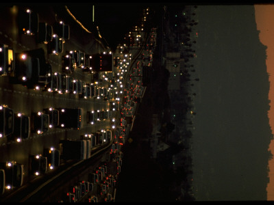 Bumper-To-Bumper Traffic At Night On Superhighway by Ralph Crane Pricing Limited Edition Print image