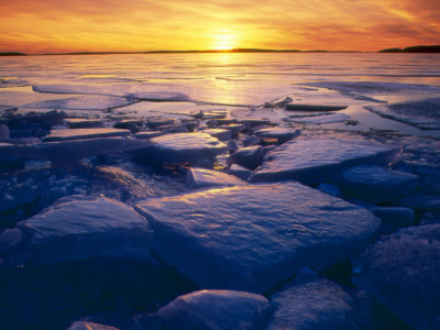 Lumps Of Ice In A Lake At Sunset by Ingemar Aourell Pricing Limited Edition Print image