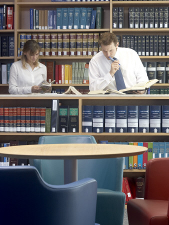 Office Life And Interiors Part Two, Employees In Library Reading by Richard Bryant Pricing Limited Edition Print image