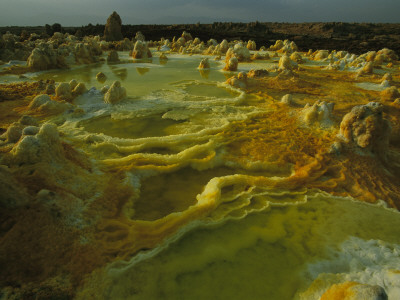 Sulphur, Salt And Other Minerals Color The Crater Of Dallol Volcano by Carsten Peter Pricing Limited Edition Print image
