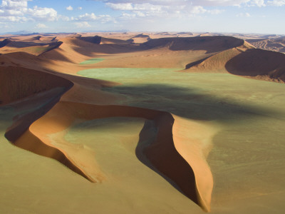 Normally Dry Grasslands Show Vivid Green Hues After Unusual Rains by Michael Poliza Pricing Limited Edition Print image