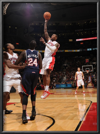 Atlanta Hawks V Toronto Raptors: Sonny Weems And Marvin Williams by Ron Turenne Pricing Limited Edition Print image