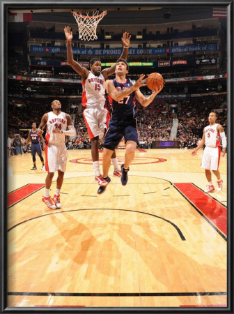 Atlanta Hawks V Toronto Raptors: Zaza Pachulia And Amir Johnson by Ron Turenne Pricing Limited Edition Print image