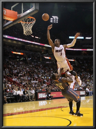 Charlotte Bobcats V Miami Heat: Dwyane Wade And Sherron Collins by Mike Ehrmann Pricing Limited Edition Print image