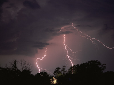 Lightning Over Floodlit Building, Pusztaszer, Hungary by Bence Mate Pricing Limited Edition Print image