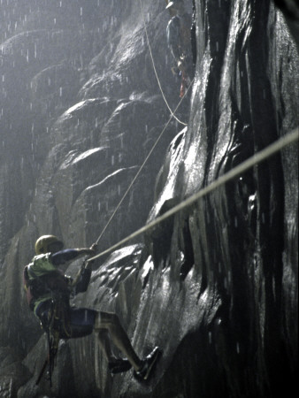 Climbers On Rock In Wet Cave, Mexico by Michael Brown Pricing Limited Edition Print image