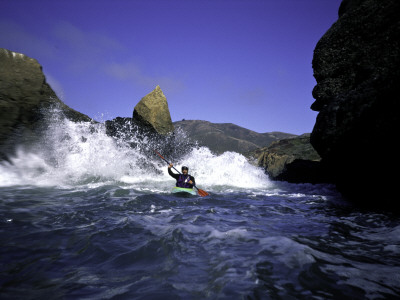 Sea Kayaking Through Rocks, Usa by Michael Brown Pricing Limited Edition Print image