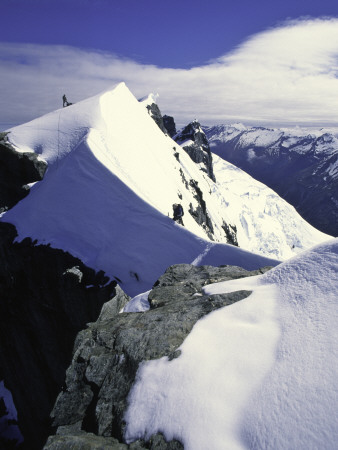 Climber Standing On Ridge On Mt. Aspiring, New Zealand by Michael Brown Pricing Limited Edition Print image