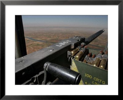 Lucy, A 50 Caliber Machine Gun, Points Out Of The Ch-46 Sea Knight by Stocktrek Images Pricing Limited Edition Print image