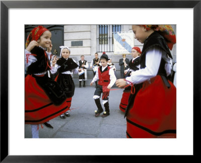 Spanish Children In National Dress Performing Outdoors At Plaza De La Puerto Del Sol, Madrid, Spain by Richard Nebesky Pricing Limited Edition Print image