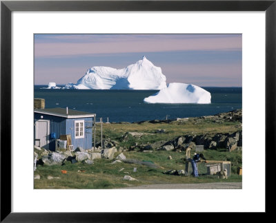 Painted Wooden Fisherman's House In Front Of Icebergs In Disko Bay, Disko Island, Greenland by Tony Waltham Pricing Limited Edition Print image