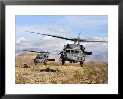 Two Hh-60 Pavehawk Helicopters Preparing To Land by Stocktrek Images Pricing Limited Edition Print image