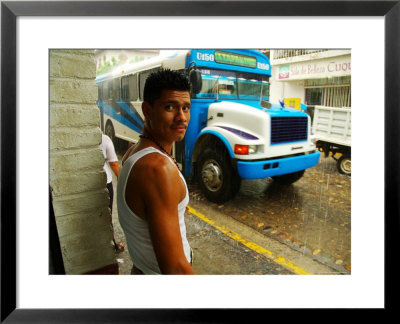 Man Waits For Bus In Torrential Tropical Downpour In Zona Centromexico by Anthony Plummer Pricing Limited Edition Print image