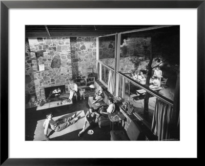 Family And Friends Sitting In A Modern Home, With Lots Of Glass by Walter Sanders Pricing Limited Edition Print image