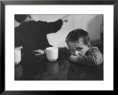 Tired Child Is Ready To Go To Sleep With His Head On The Dining Room Table At Ellis Island by Alfred Eisenstaedt Pricing Limited Edition Print image