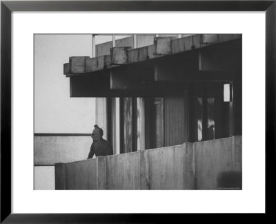 Masked Black September Arab Terrorist Looking From Balcony Of Athletes Housing Complex by Co Rentmeester Pricing Limited Edition Print image